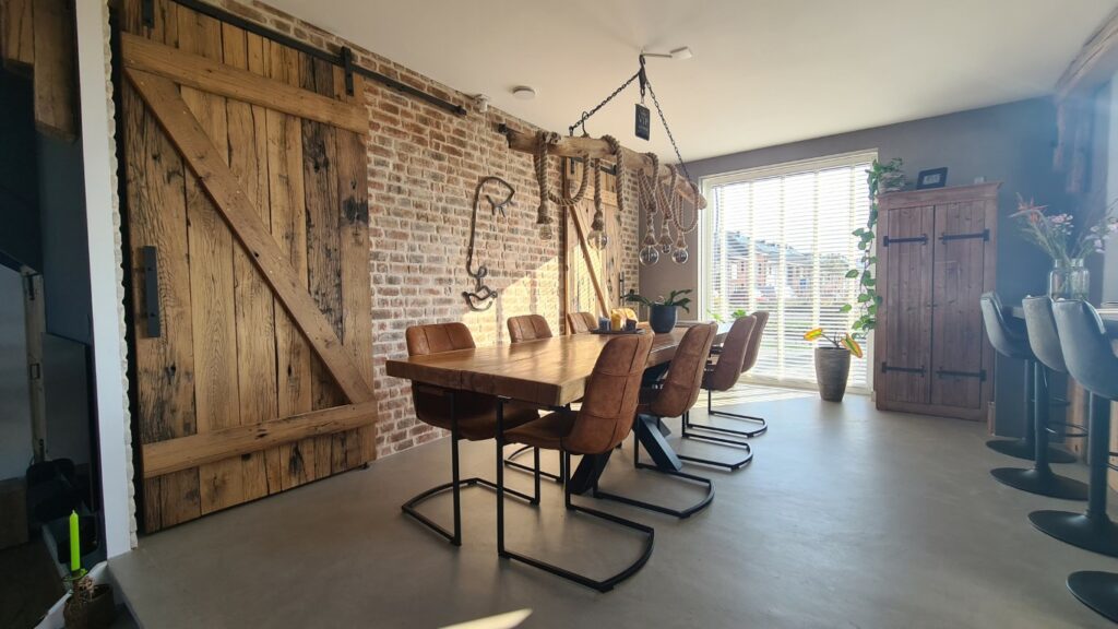 Old oak loft door of planed wagon planks on clean masonry