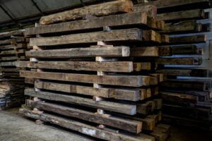 Presentation of a pack of old beams in the old wood shed