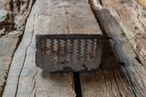 Presentation of whole oak railroad ties blasted in close-up situated from the end side