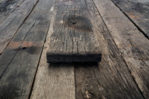 Rough unprocessed wagon plank on top of planks