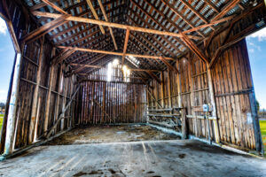 Presentation of old barn made of barnwood in sunlight