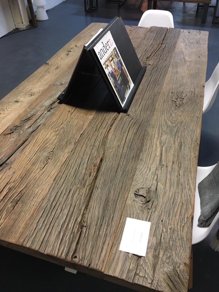 Table of oak barnwood in home store