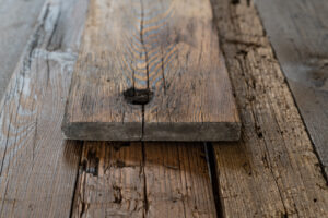 Presentation of pine wagon shelf with bolt hole on table