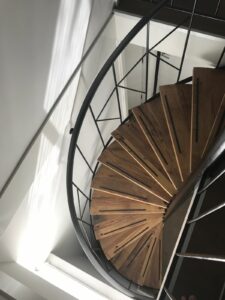Presentation of spiral staircase with composite wagon planks as treads