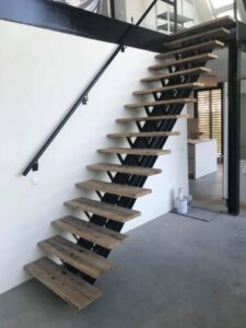Presentation of steel staircase with composite wagon planks as treads