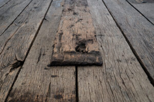 Presentation of raw oak wagon plank that has been brushed and blued.