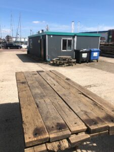 Pack brushed oak wagon boards outside on site of hmh