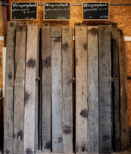 Collection of different types of brushed wagon boards in the old wood shed