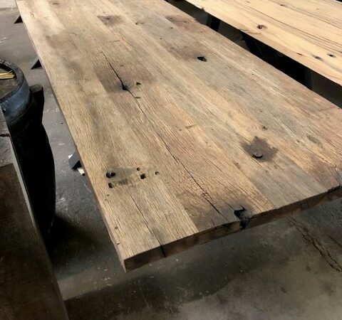Multiple tables brushed wagon planks side by side with color differences
