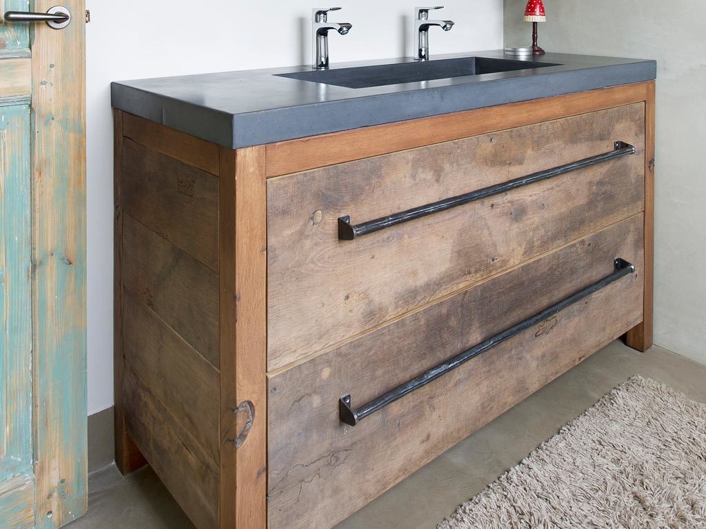 Presentation old oak bathroom furniture with steel handles and concrete top